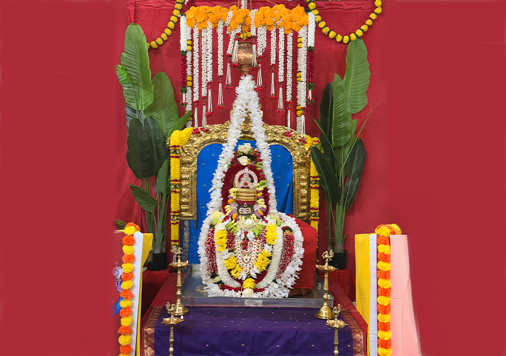 Beautifully decorated Shiva Lingam with floral garlands and traditional lamps at Hari Hara Kshethram temple.